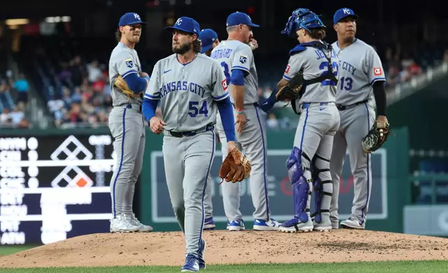 Kansas City Royals pitcher Mitch Spence (54) is removed by manager Matt Quatraro, third from right, during the fifth inning of a baseball game against the Washington Nationals, Monday, June 15, 2026, in Washington. (AP Photo/Terrance Williams)