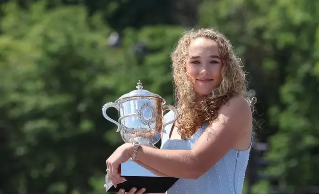 Russia's Mirra Andreeva poses with her Trophy a day after winning the Roland Garros French Open tennis tournament, in Paris, Sunday June 7, 2026. (Xavier Galiana, Pool Photo via AP)