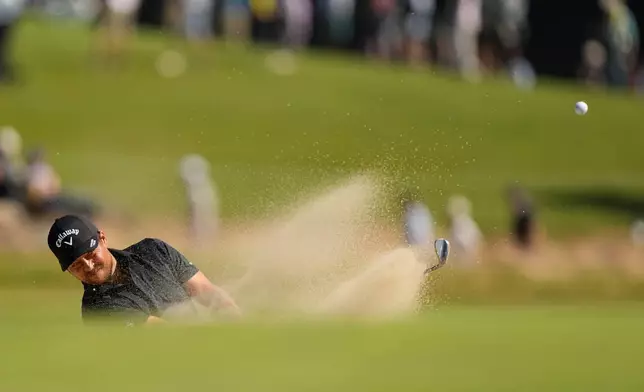 Xander Schauffele hits from the bunker on the second hole during the third round of the U.S. Open golf tournament at Shinnecock Hills Golf Club in Southampton, N.Y., Saturday, June 20, 2026.(AP Photo/Gerald Herbert)