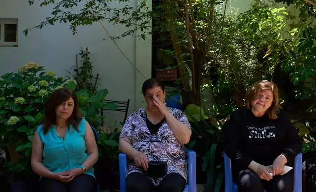 From left, Lolitta Costantine, Wadiaa Salloum, and Marie Salloum sit outside Costantine's home in the southern town of Jdeidat Marjayoun, Lebanon, Thursday, June 11, 2026. (AP Photo/Hassan Ammar) CORRECTION: City corrected to Jdeidat Marjayoun, instead of Marjayoun.
