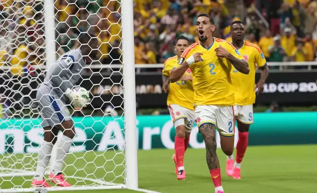 Colombia's Daniel Munoz (2) celebrates after scoring his side's opening goal during the World Cup Group K soccer match between Colombia and Congo in Zapopan, near Guadalajara, Mexico, Tuesday, June 23, 2026. (AP Photo/Fernando Llano)