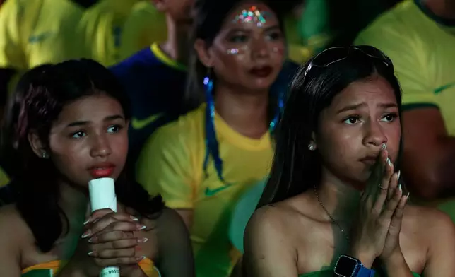 Brazil fans react while watching the World Cup match between Brazil and Morocco in Manaus, Brazil, Saturday, June 13, 2026. (AP Photo/Edmar Barros)