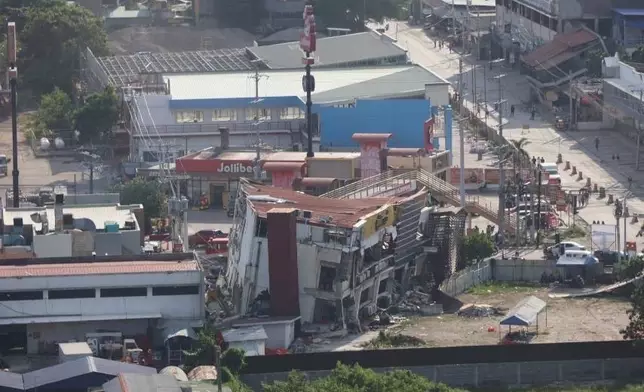 In this photo provided by the Philippine Coast Guard, damaged structures are seen a day after a strong earthquake struck in General Santos city, southern Philippines on Tuesday, June 9, 2026. (Philippine Coast Guard via AP)