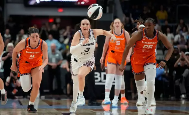 Toronto Tempo's Marina Mabrey (3) chases down the loose ball in the final seconds for the Tempo win against the Connecticut Sun during the second half of a WNBA game in Toronto, Wednesday, June 10, 2026. (Frank Gunn/The Canadian Press via AP)