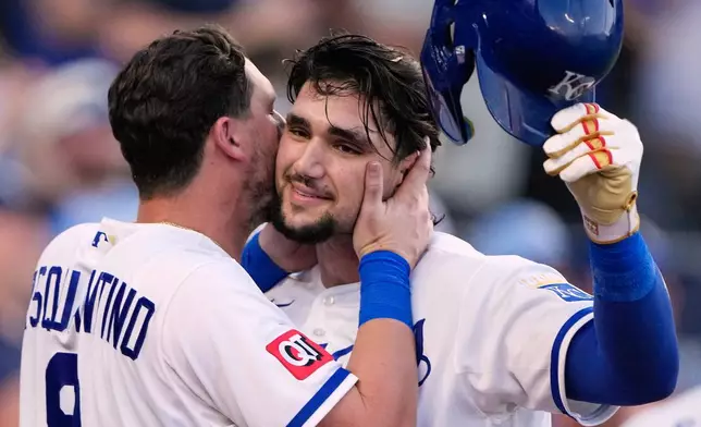 Kansas City Royals' Jac Caglianone, right, celebrates with Vinnie Pasquantino (9) after hitting a solo home run during the fifth inning of a baseball game against the Texas Rangers, Tuesday, June 9, 2026, in Kansas City, Mo. (AP Photo/Charlie Riedel)
