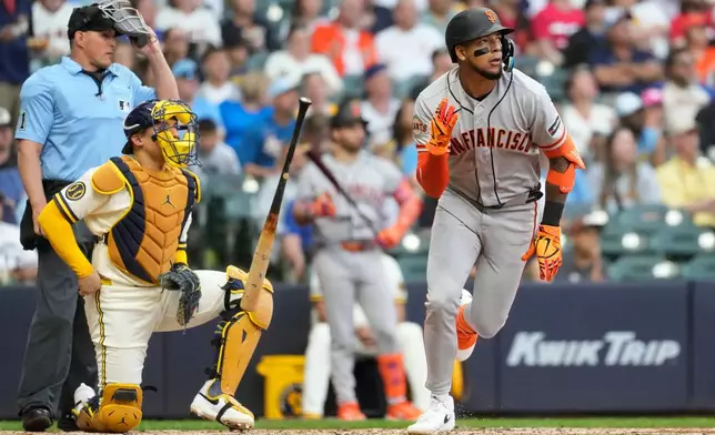 San Francisco Giants' Victor Bericoto tosses his bat after hitting a solo home run during the fifth inning of a baseball game against the Milwaukee Brewers, Wednesday, June 3, 2026, in Milwaukee. (AP Photo/Aaron Gash)