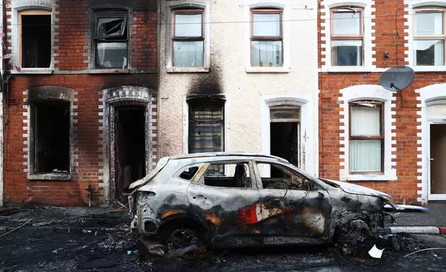 A view of the damage after rioting broke out late Tuesday, in east Belfast, Northern Ireland, Wednesday, June 10, 2026, following a stabbing incident. (AP Photo/Peter Morrison)