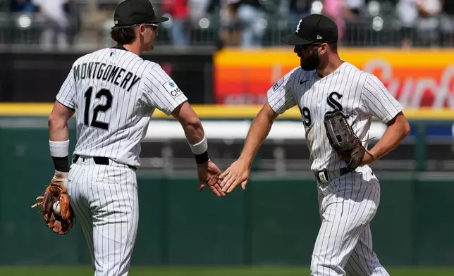 Chicago White Sox's Colson Montgomery, left, celebrates with Tristan Peters after the White Sox defeated the Detroit Tigers in a baseball game in Chicago, Sunday, May 31, 2026. (AP Photo/Nam Y. Huh)