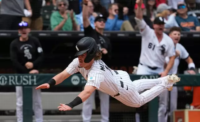 Chicago White Sox's Chase Meidroth scores on a one-run single by Tristan Peters during the seventh inning of a baseball game against the Detroit Tigers in Chicago, Sunday, May 31, 2026. (AP Photo/Nam Y. Huh)
