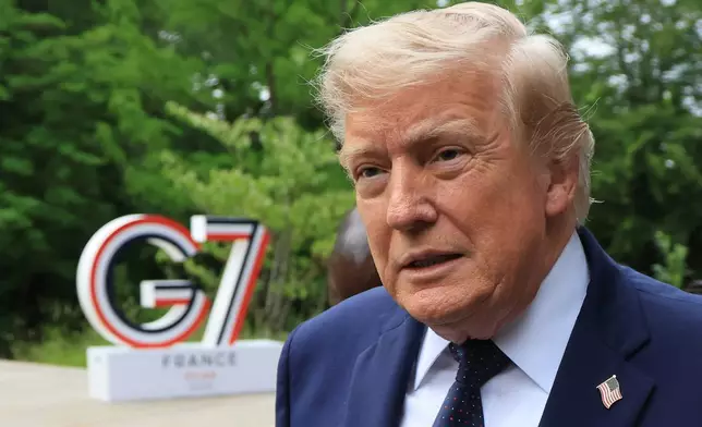 U.S. President Donald Trump arrives to attend a musical interlude before a gala dinner as part of the G7 summit, in Evian-les-Bains, France, Tuesday June 16, 2026. (Ludovic MARIN/Pool Photo via AP)