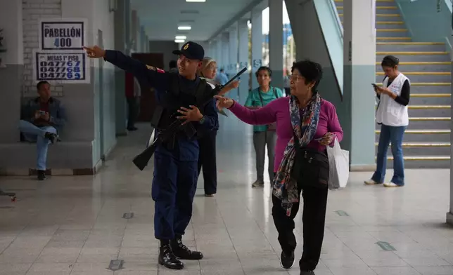 Voters arrive to a polling station during the presidential runoff election in Lima, Peru, Sunday, June 7, 2026. (AP Photo/Guadalupe Pardo)