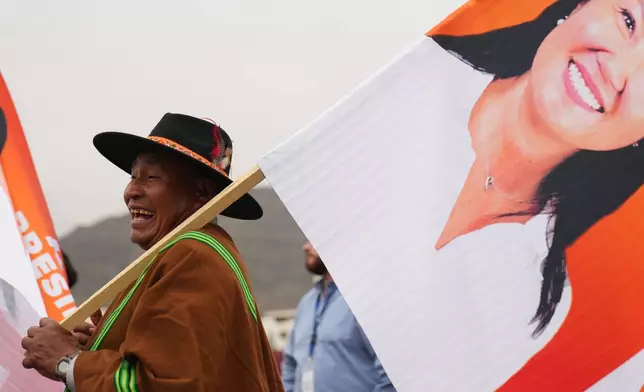 A supporters hols a banner of presidential candidate Keiko Fujimori during her closing campaign rally in Lima, Peru, Thursday, June 4, 2026. (AP Photo/Rodrigo Abd)