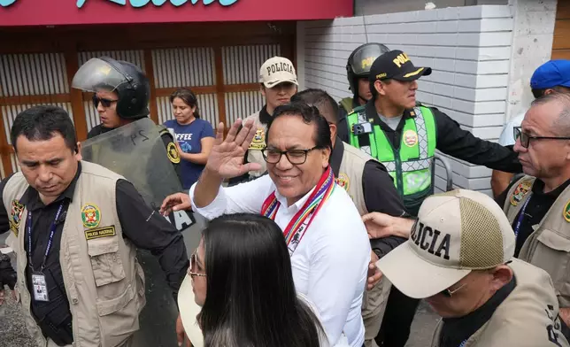 Presidential candidate Roberto Sanchez of the Together for Peru party arrives to vote during the presidential runoff election in Lima, Peru, Sunday, June 7, 2026. (AP Photo/Rodrigo Abd)