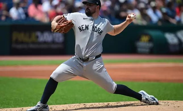 New York Yankees starting pitcher Carlos Rondon delivers during the first inning of a baseball game against the Cleveland Guardians, Wednesday, June 10, 2026, in Cleveland. (AP Photo/David Dermer)
