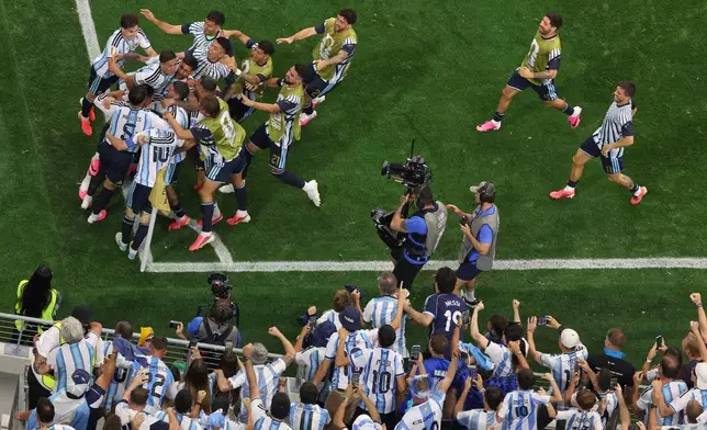 Argentina players and fans celebrate after Lionel Messi scored their second goal during the World Cup Group J soccer match between Argentina and Austria in Arlington, Texas, near Dallas, Monday, June 22, 2026. (AP Photo/Sam Hodde)