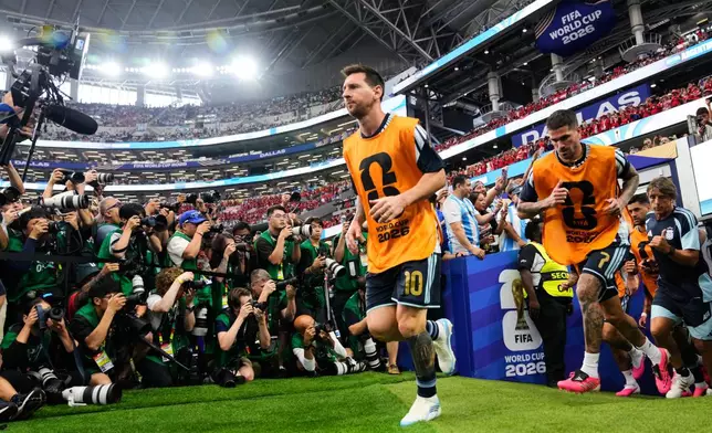 Argentina's Lionel Messi (10) and Rodrigo De Paul enter the field for warm up prior to the World Cup Group J soccer match between Argentina and Austria in Arlington, Texas, near Dallas, Monday, June 22, 2026. (AP Photo/Tony Gutierrez)
