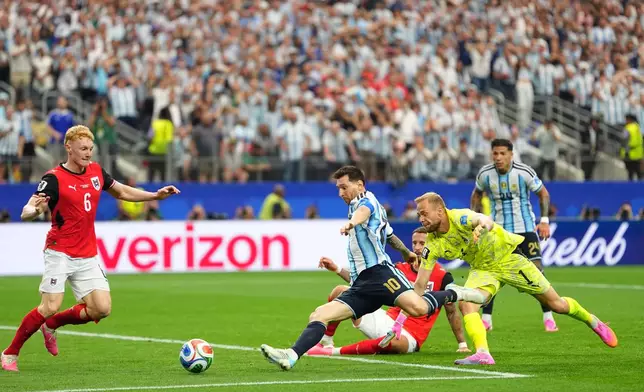 Argentina's Lionel Messi, center, scores his side's second goal during the World Cup Group J soccer match between Argentina and Austria in Arlington, Texas, near Dallas, Monday, June 22, 2026. (AP Photo/Julio Cortez)