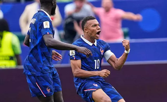 France's Kylian Mbappe (10) celebrates after scoring his team's first goal during the World Cup Group I soccer match between France and Iraq in Philadelphia, Monday, June 22, 2026. (AP Photo/Petr David Josek)