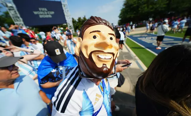 An Argentina fan wears a mask of Argentina's Lionel Messi outside the stadium before the World Cup Group J soccer match between Argentina and Austria in Arlington, Texas, near Dallas, Monday, June 22, 2026. (AP Photo/Julio Cortez)