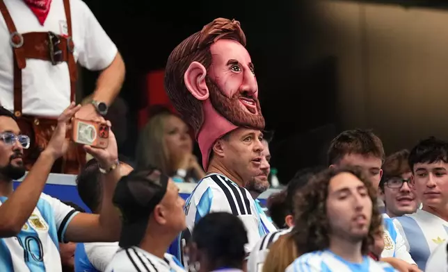 An Argentina fan wears a Lionel Messi big head on the stands before the World Cup Group J soccer match between Argentina and Austria in Arlington, Texas, near Dallas, Monday, June 22, 2026. (AP Photo/Julio Cortez)