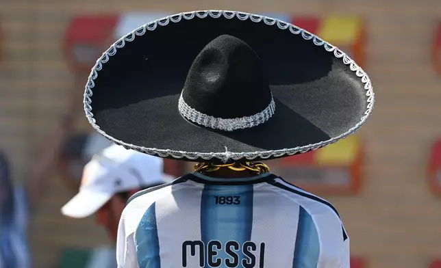 A fan wearing a Mexican charro hat arrives to the stadium for the World Cup Group J soccer match between Argentina and Austria in Arlington, Texas, near Dallas, Monday, June 22, 2026. (AP Photo/Jessica Tobias)