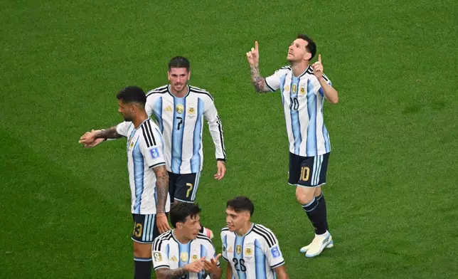 Argentina's Lionel Messi, right, celebrates scoring his side's opening goal during the World Cup Group J soccer match between Argentina and Austria in Arlington, Texas, near Dallas, Monday, June 22, 2026. (AP Photo/Jessica Tobias)