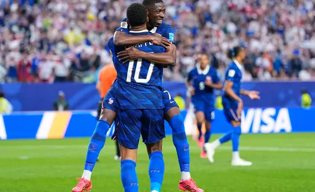 France's Ousmane Dembele (7) congratulates teammate Kylian Mbappe (10) after he scored their second goal during the World Cup Group I soccer match between France and Iraq in Philadelphia, Monday, June 22, 2026. (AP Photo/Petr David Josek)