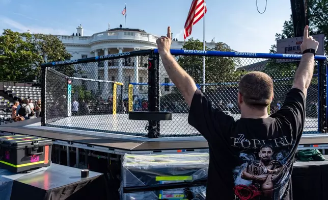 Members of the media view the arena for the UFC Freedom 250 fights on the South Lawn of the White House, Thursday, June 11, 2026, in Washington. (AP Photo/Alex Brandon)