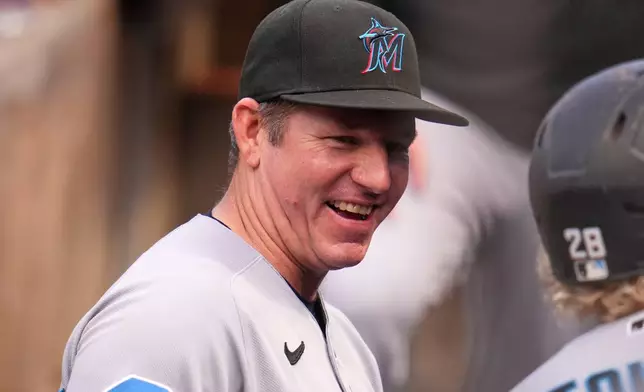 Miami Marlins manager Clayton McCullough stands in the dugout before a baseball game against the Pittsburgh Pirates in Pittsburgh, Friday, June 12, 2026. (AP Photo/Gene J. Puskar)
