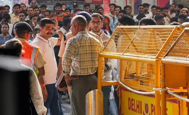 Saurabh Das, center, spokesperson of Cockroach Janta Party waits for the arrival of Abhijeet Dipke, founder of CJP at Indira Gandhi International airport in New Delhi, India, Saturday, June 6, 2026. (AP Photo/Manish Swarup)