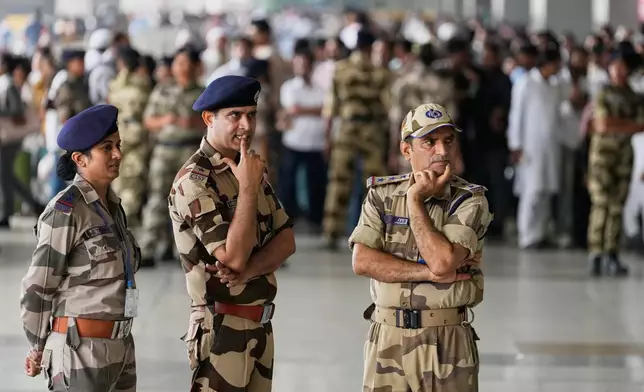 Security personnel stand guard before the arrival of Abhijeet Dipke, founder of Cockroach Janta at Indira Gandhi International airport in New Delhi, India, Saturday, June 6, 2026. (AP Photo/Manish Swarup)