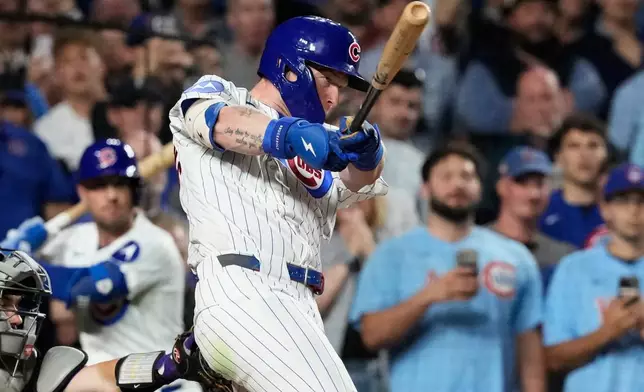 Chicago Cubs' Pete Crow-Armstrong hits a single to complete the cycle during the seventh inning of a baseball game against the Colorado Rockies in Chicago, Monday, June 15, 2026. (AP Photo/Nam Y. Huh)