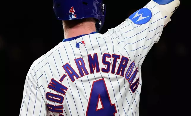 Chicago Cubs' Pete Crow-Armstrong celebrates after hitting a single to complete the cycle during the seventh inning of a baseball game against the Colorado Rockies in Chicago, Monday, June 15, 2026. (AP Photo/Nam Y. Huh)