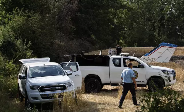 Forensic technicians examine the wreckage of the Cessna 421 piloted by Ubisoft co-founder Claude Guillemot, who was killed when the aircraft crashed while approaching La Baule-Escoublac airfield Friday evening, in La Baule, western France, Saturday, June 20, 2026. (AP Photo/Jeremia Gonzalez)