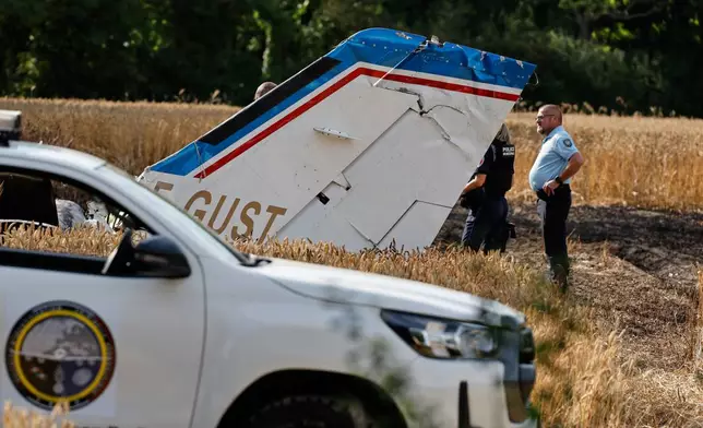 Forensic technicians examine the wreckage of the Cessna 421 piloted by Ubisoft co-founder Claude Guillemot, who was killed when the aircraft crashed while approaching La Baule-Escoublac airfield Friday evening, in La Baule, western France, Saturday, June 20, 2026. (AP Photo/Jeremia Gonzalez)