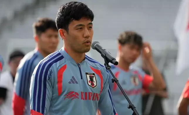 Japan's Wataru Endo addresses fans before a training session Monday, June 8, 2026, in Nashville, Tenn., ahead of the World Cup soccer tournament. (AP Photo/George Walker IV)