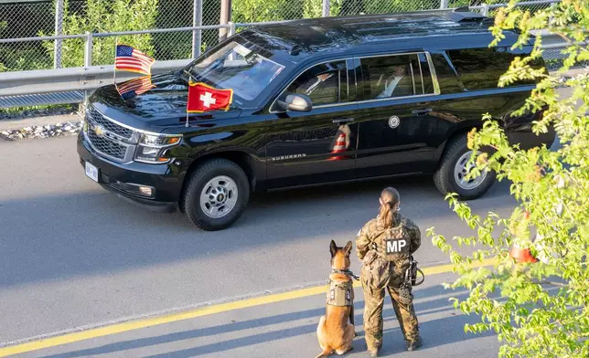 A convoy with U.S. Vice President JD Vance arrives at the Bürgenstock Resort in Obbuergen, near Lucerne, in Switzerland Sunday, June 21, 2026. (Urs Flueeler/Keystone, Pool Photo via AP)