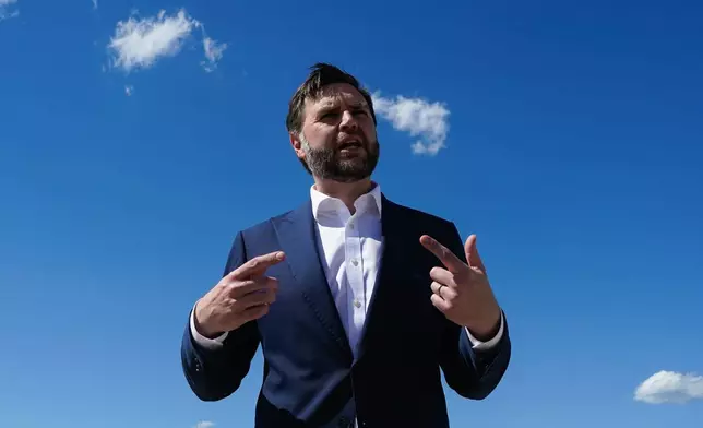 Vice President JD Vance speaks to reporters at Joint Base Andrews, Md., Saturday, June 20, 2026, en route to Switzerland. (Elizabeth Frantz/Pool Photo via AP)