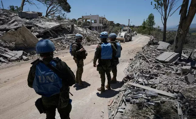 Spanish U.N peacekeepers deploy at a road in Dibbine village, southeast Lebanon, Friday, June 5, 2026, a day after Israeli forces withdrew following intense clashes with Hezbollah fighters. (AP Photo/Hussein Malla)