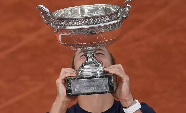Germany's Alexander Zverev celebrates after winning the final tennis match against Italy's Flavio Cobolli at the French Open in Paris, Sunday, June 7, 2026. (AP Photo/Thibault Camus)