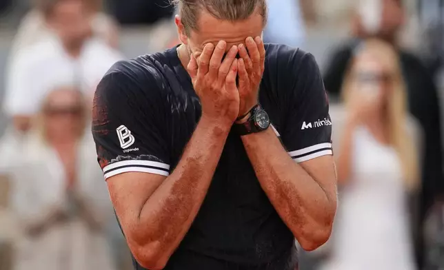 Alexander Zverev of Germany celebrates after winning the men's final match against Flavio Cobolli of Italy at the French Open tennis tournament in Paris, Sunday, June 7, 2026. (AP Photo/Christophe Ena)