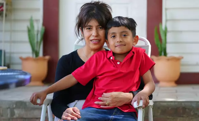 Maria Contreras, left, poses for a photo with her son, Ian Contreras on Thursday, April 9, 2026, in Fort Worth, Texas. (AP Photo/Julio Cortez)