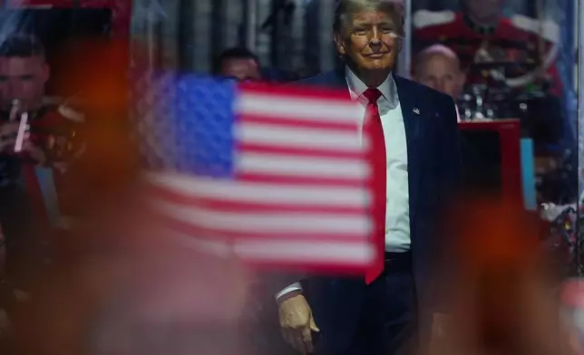 President Donald Trump stands on stage after speaking at the opening of the Great American State Fair on the National Mall, Wednesday, June 24, 2026, in Washington. (AP Photo/Julia Demaree Nikhinson)