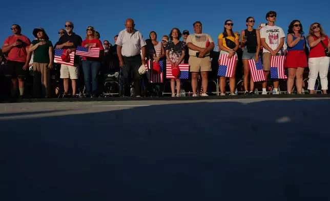 People arrive before President Donald Trump speaks at the opening of the Great American State Fair on the National Mall, Wednesday, June 24, 2026, in Washington. (AP Photo/Julia Demaree Nikhinson)
