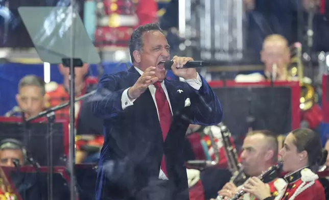Christopher Maccihio sings before President Donald Trump speaks at the opening of the Great American State Fair on the National Mall, Wednesday, June 24, 2026, in Washington. (AP Photo/Alex Brandon)