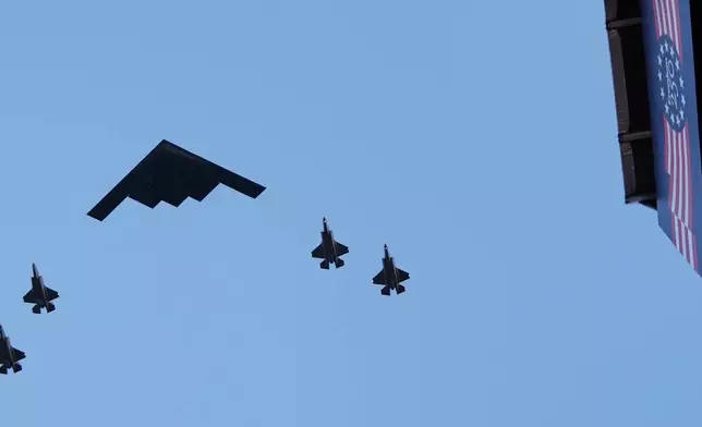 A B-2 stealth bomber and escorts, fly over the opening of the Great American State Fair, Wednesday, June 24, 2026, in Washington. (AP Photo/Jacquelyn Martin)