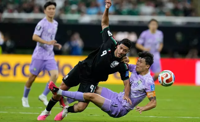 Mexico's Raul Jimenez (9), center, vies for the ball with South Korea's Kim Min-jae (4) during the World Cup Group A soccer match between Mexico and South Korea in Zapopan, near Guadalajara, Mexico, Thursday, June 18, 2026. (AP Photo/Ricardo Mazalan)