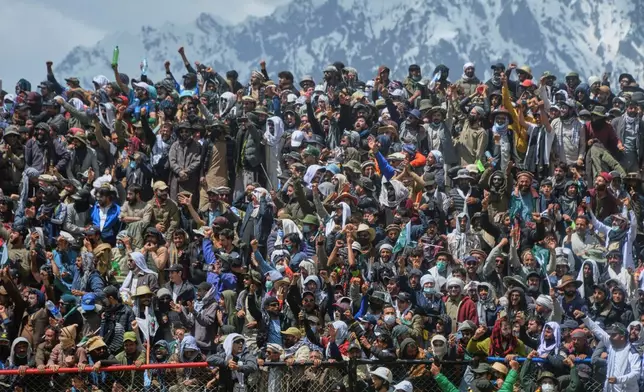 Spectators cheer during the final match of the three-day annual Shandur Polo Festival in Shandur Pass, in the Ghizer district of Gilgit-Baltistan, northern Pakistan, Saturday, June 13, 2026. (AP Photo/Zubair Abbasi)