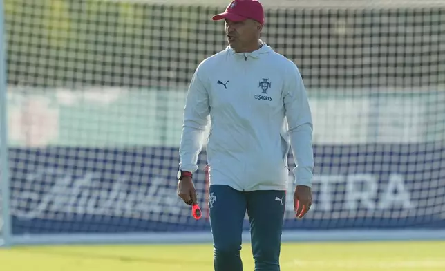 Portugal's head coach Roberto Martinez keeps and eye on the men's national soccer team training session ahead of their FIFA World Cup soccer tournament Saturday, June 13, 2026, in Palm Beach Gardens, Fla. (AP Photo/Marta Lavandier)