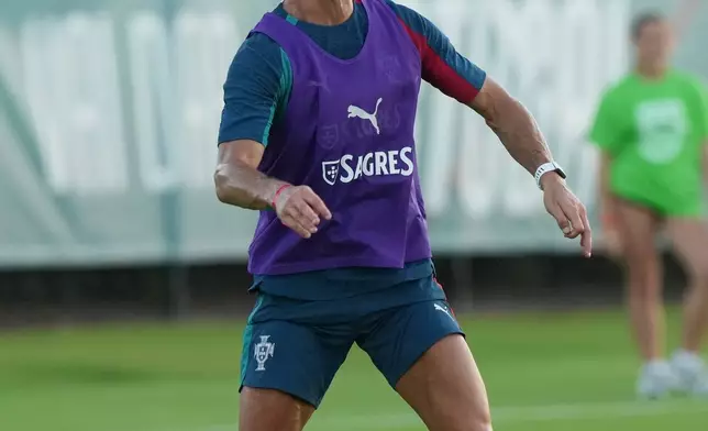 Portugal's Cristiano Ronaldo warms up during the men's national soccer team training session ahead of their FIFA World Cup soccer tournament Saturday, June 13, 2026, in Palm Beach Gardens, Fla. (AP Photo/Marta Lavandier)